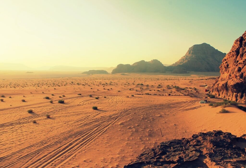 pexels-photo-106606 Explore the stunning beauty of Wadi Rum's arid desert landscape, bathed in warm sunset hues.